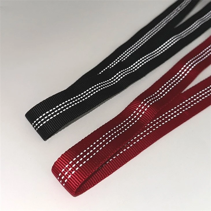 Reflective tubular webbing for safety harness